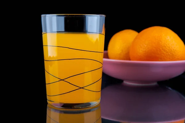 Juice and peaches on a black background — Stock Photo, Image