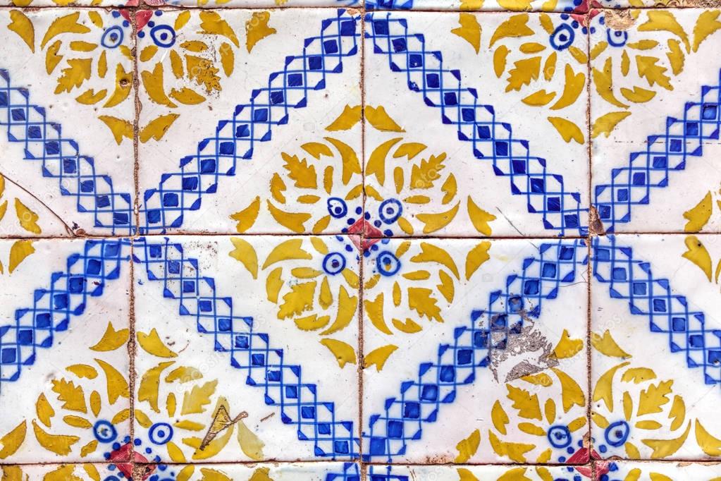 Detail of traditional  tiles on facade of old house