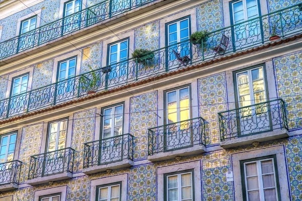 Colored facade in the city of Lisbon . Portugal .