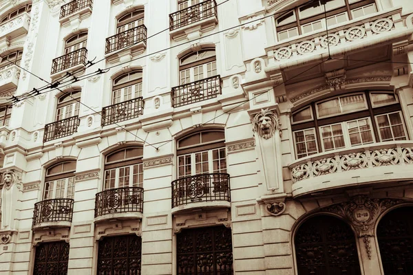 Bright colorful facade of old European building with windows . — Stock Photo, Image