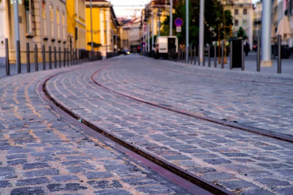 Street with a tram line of rails. Selective focus .