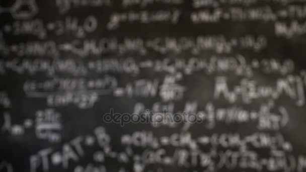 Chemical and mathematical equations wall room background focused and defocused action — Stock Video