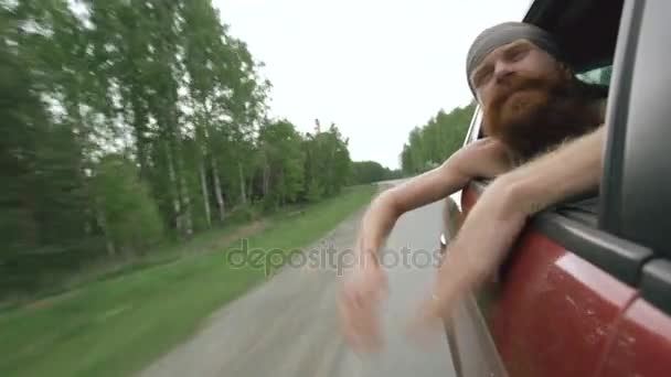 Happy young tourist man have fun and joy in window of car while travelling — Stock Video