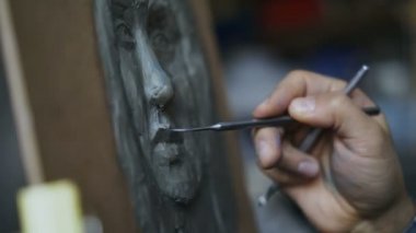 Tuval sanat atölyesi olarak heykel insanlar yüz oluşturma heykeltıraş Close-Up