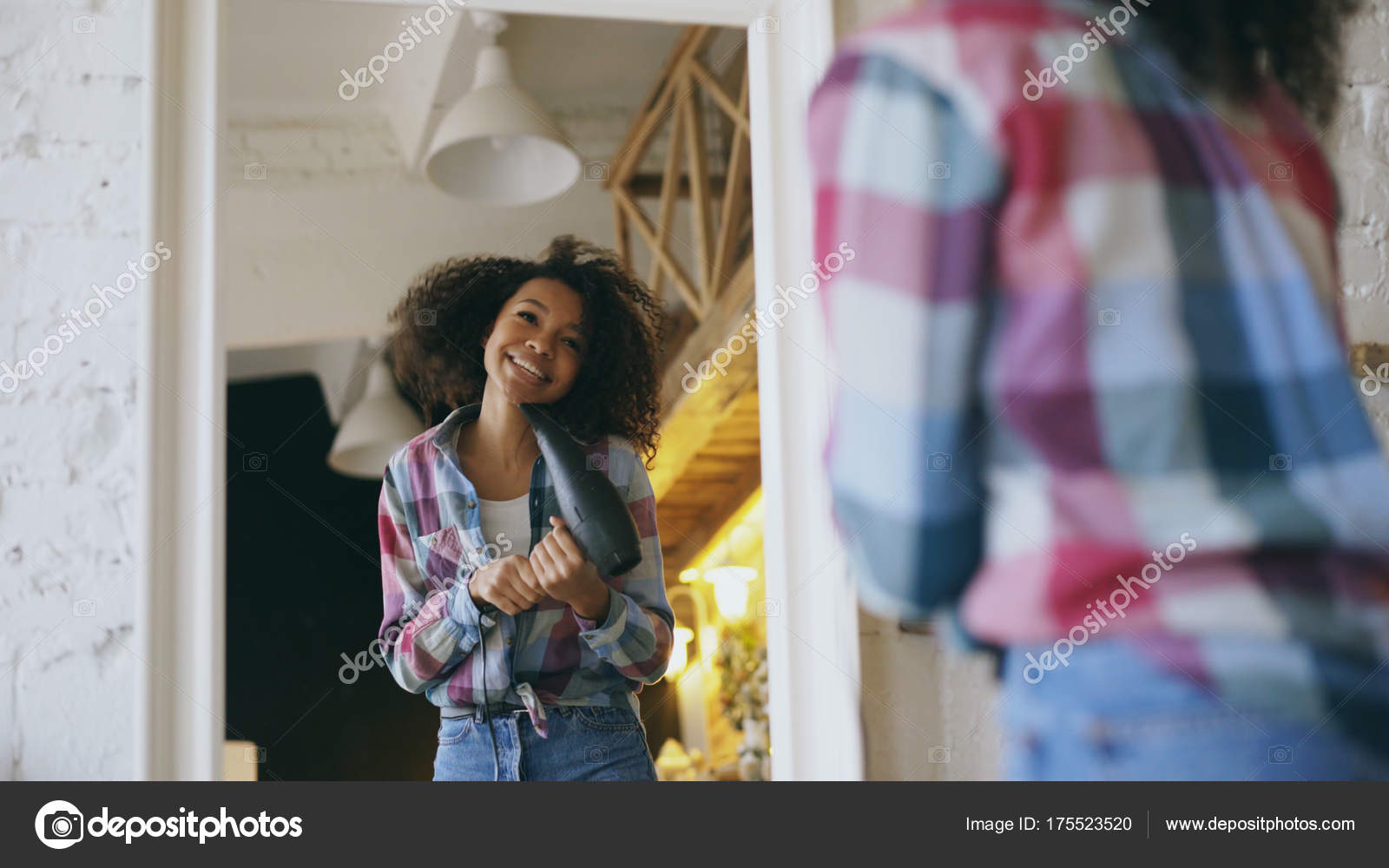 Curly funny african american girl dancing and singing with hair dryer in front of mirror at home Stock Photo by ©silverkblack 175523520 Curly funny african american girl dancing and singing with hair dryer in front of mirror at home Stock Photo by ©silverkblack 175523520