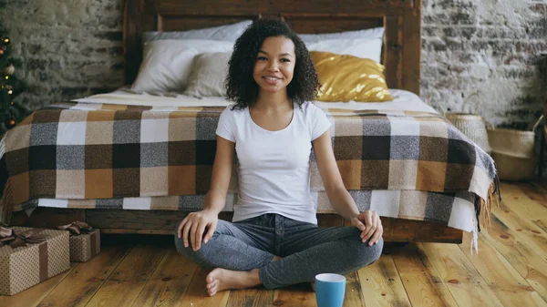 Attractive mixed race girl teenager recording video blog looking into camera and talking to her followers at home — Stock Photo, Image