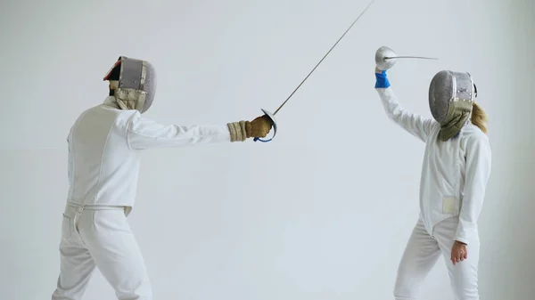 Two fencers have fencing training on white background — Stock Photo, Image