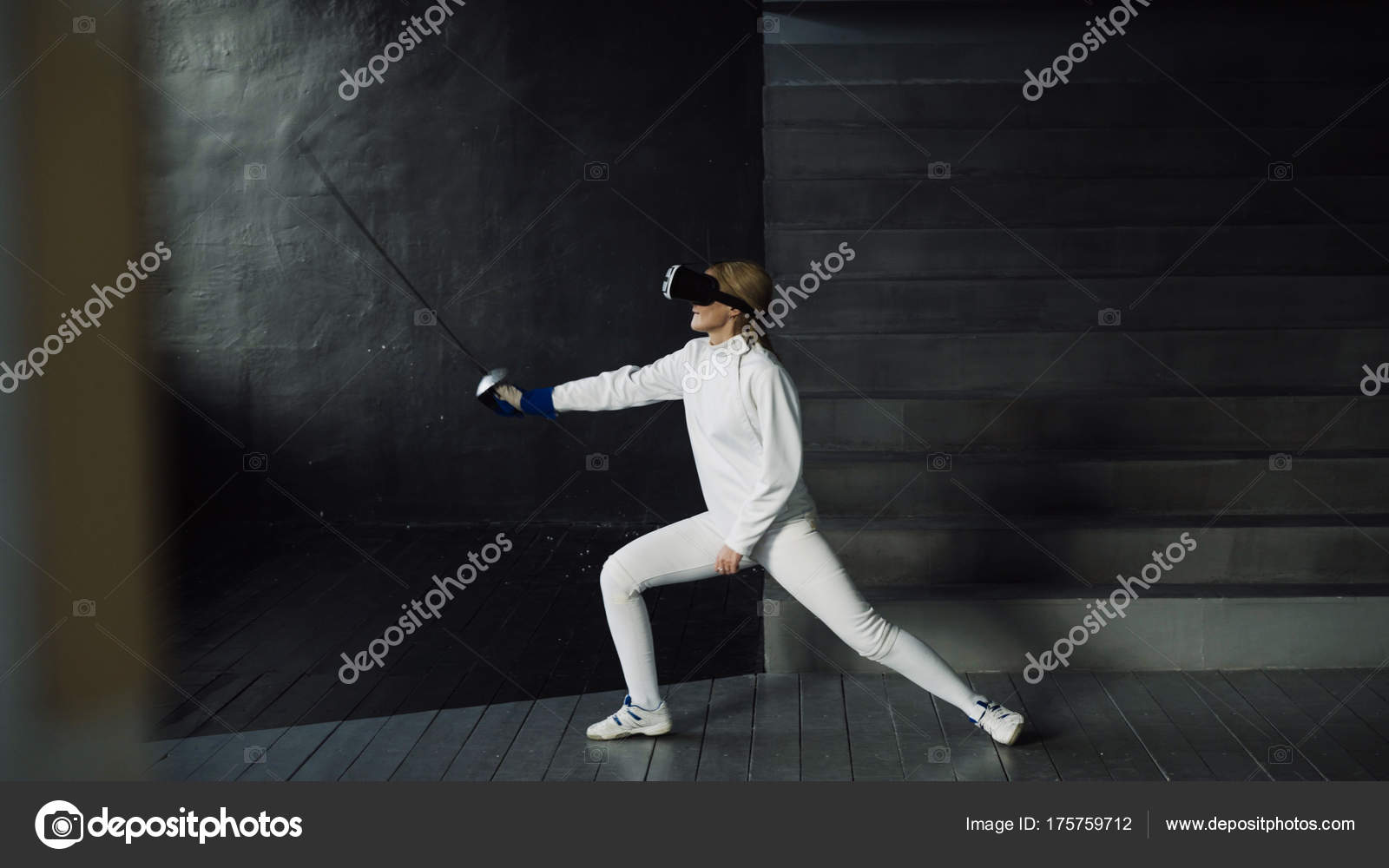 Concentrated fencer woman practice fencing exercises using VR headset and training simulator