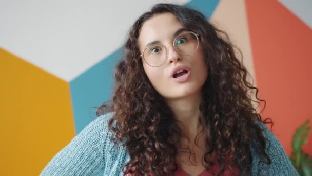 Portrait of joyful mixed race woman making funny faces grimaces having fun laughing — 비디오