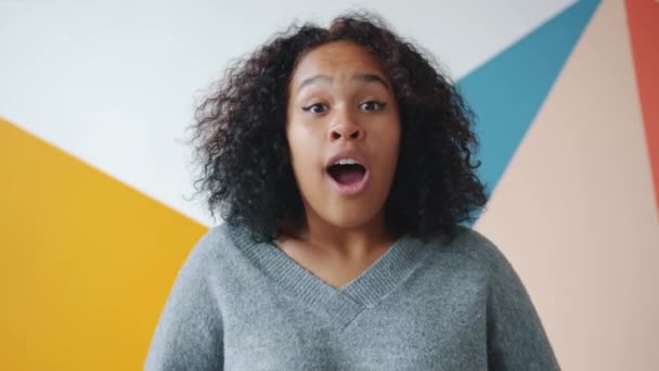 Happy African American lady looking at camera expressing excitement and joy — 비디오