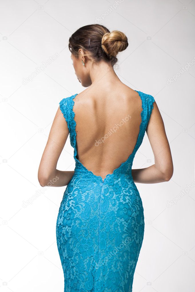 Back view, Beautiful young woman in turquoise tight clothes
