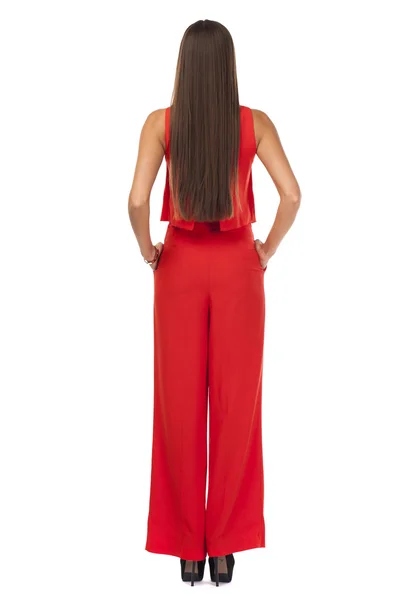 Vista traseira. Jovem morena em pantsuit vermelho — Fotografia de Stock