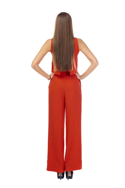 Vista traseira. Jovem morena em pantsuit vermelho — Fotografia de Stock