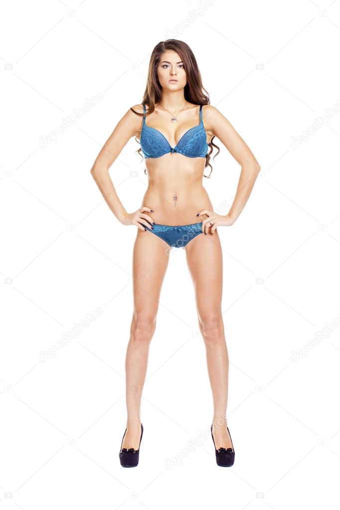 Full length portrait of young girl wearing blue bikini