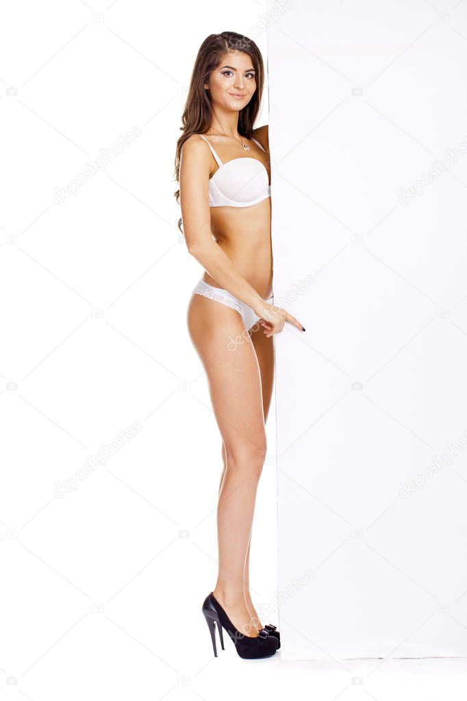 Portrait of young woman wearing white bikini
