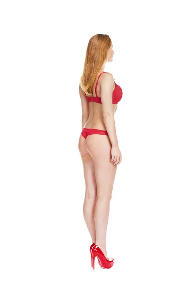 Szép fiatal szőke nő, vörösben bikini — Stock Fotó