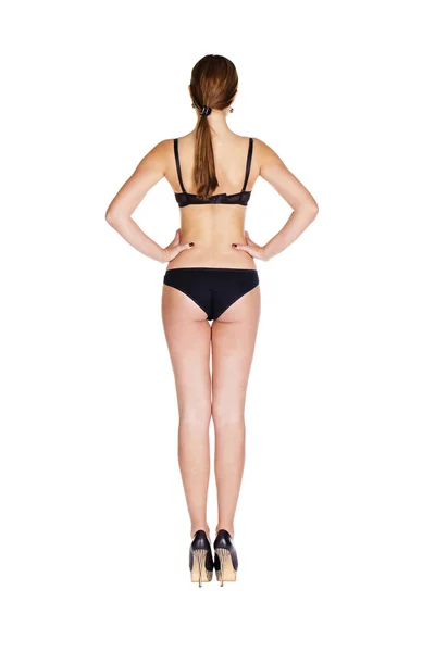 Ganzkörperporträt einer jungen Frau in schwarzer Unterwäsche — Stockfoto