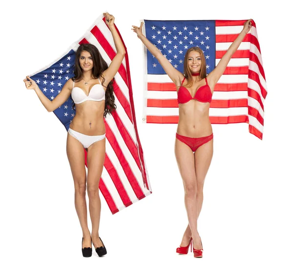 Beautiful girl in bikini holding the USA flag Stock Image