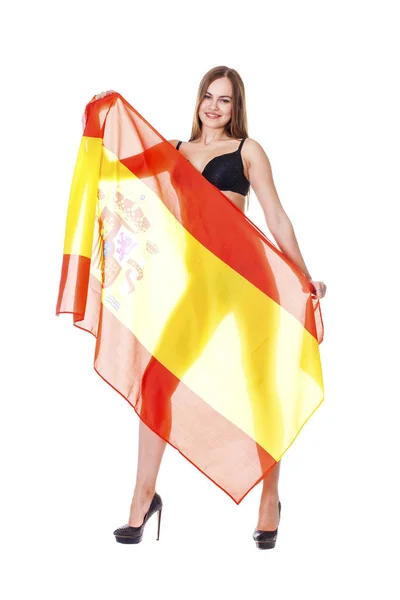 Mladá žena držící velké průhledné španělská vlajka — Stock fotografie