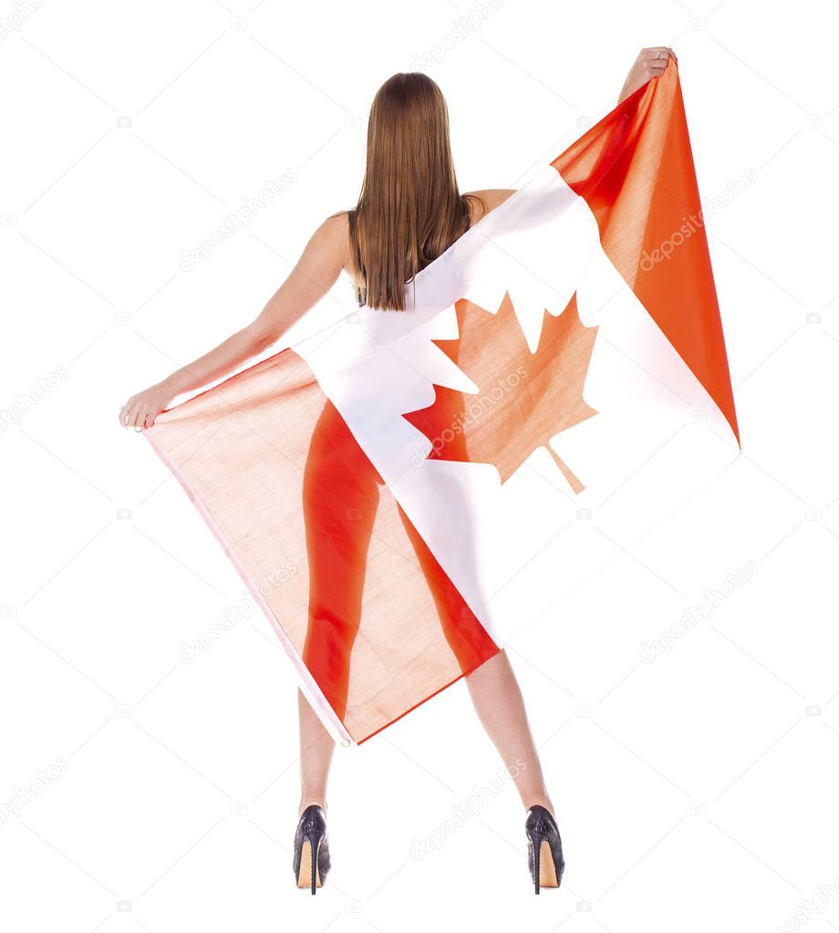 Beautiful woman holding a large Canadian flag