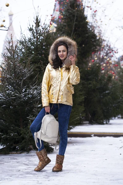 stock image Young beautiful woman in golden jacket 