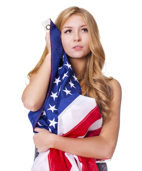 Young sexy blonde embracing the American flag