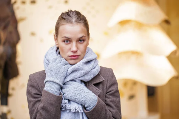 Portrait of a young beautiful woman in gray coat — Stock Photo, Image