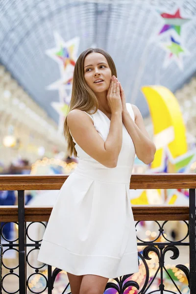 Beautiful brunette woman in white dress — Stock Photo, Image