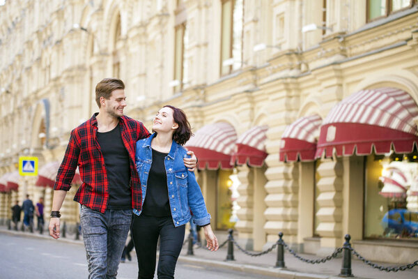 Happy tourists sightseeing city with map