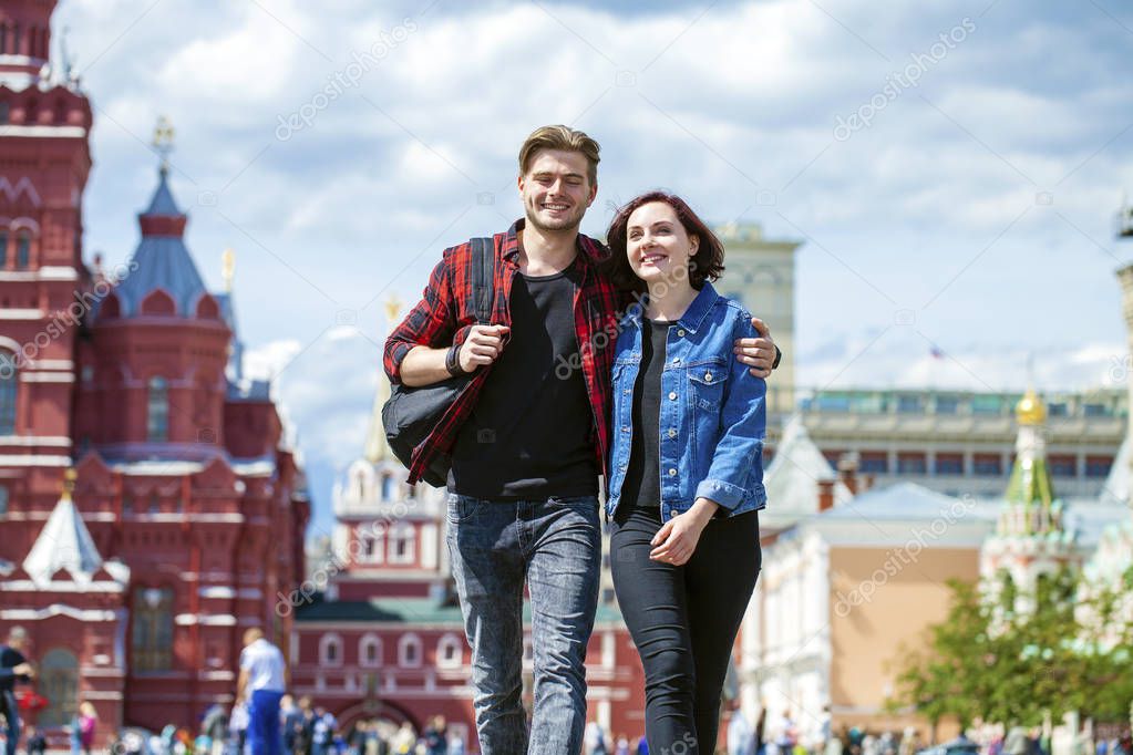 Beautiful young couple on a walk in the city