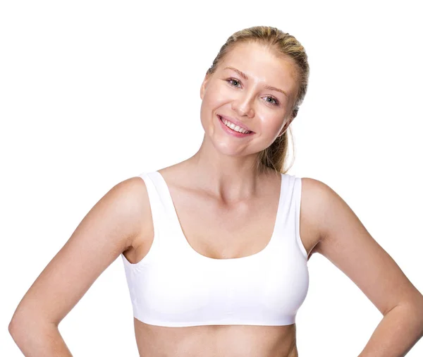 Unga vackra blonda kvinnan i vit fitness kläder — Stockfoto