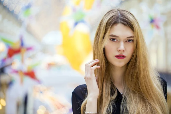 Beautiful blonde girl in black blouse — Stock Photo, Image