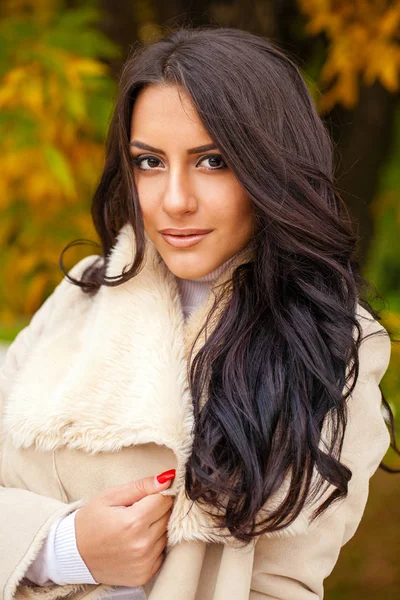 Beautiful arab woman warmly clothed autumn outdoor