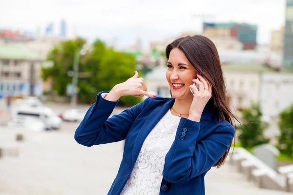 Beautiful woman making a call me gesture — Stock Photo, Image