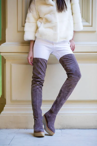 Woman legs in suede boots — Stock Photo, Image