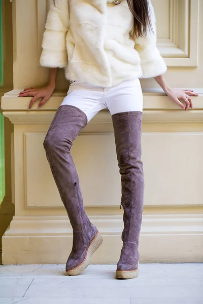 Woman legs in suede boots — Stock Photo, Image