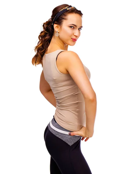 Mladá krásná brunetka žena v béžové sportovní vesta — Stock fotografie