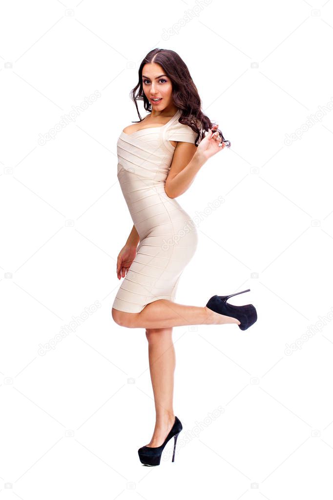 Young arabic woman in beige sexy dress
