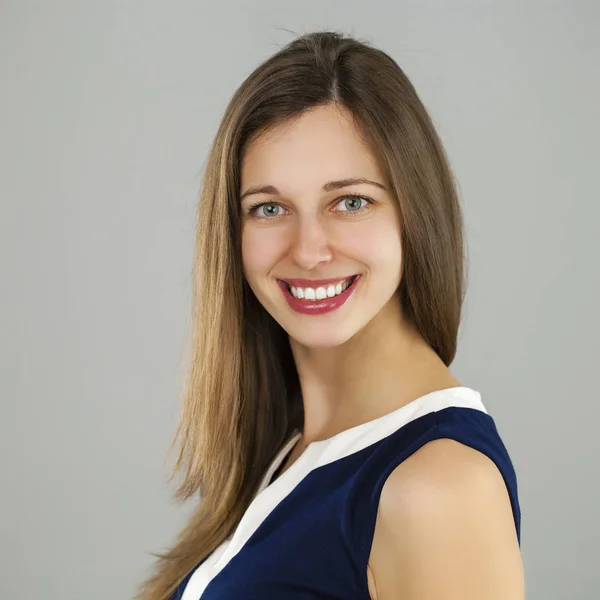 Beautiful woman face close up portrait young studio on gray — Stock Photo, Image