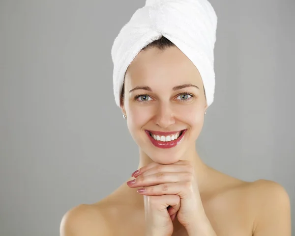 Beautiful young woman posing in white towel — Stock Photo, Image