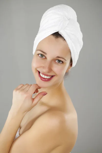 Beautiful young woman posing in white towel — Stock Photo, Image