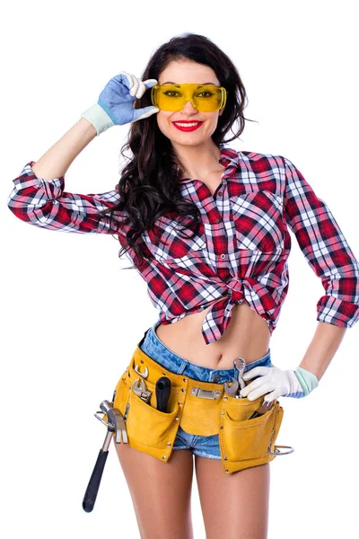 Sexy brunette woman mechanic with yellow safety glasses — Stock Photo, Image