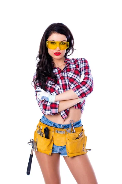 Sexy brunette woman mechanic with yellow safety glasses — Stock Photo, Image