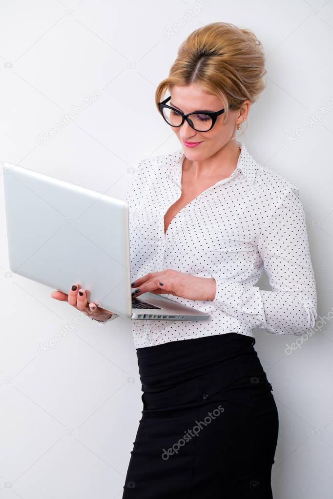 Young business woman using laptop 