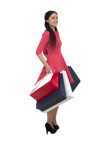 Mladá bruneta žena s nějakou nákupní tašky — Stock fotografie