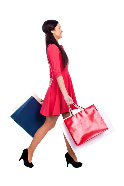 Fiatal barna nő, néhány bevásárló táskák — Stock Fotó