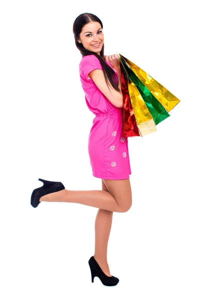 Mujer morena joven con algunas bolsas de compras —  Fotos de Stock