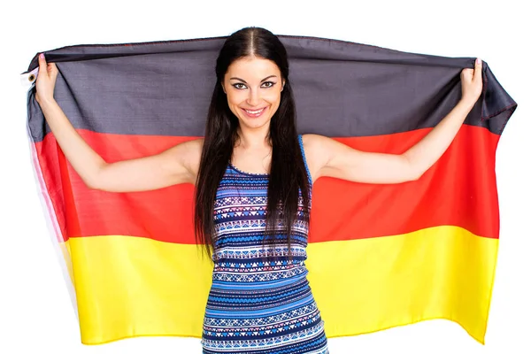Ung vacker kvinna som håller en stor flagga Tyskland — Stockfoto