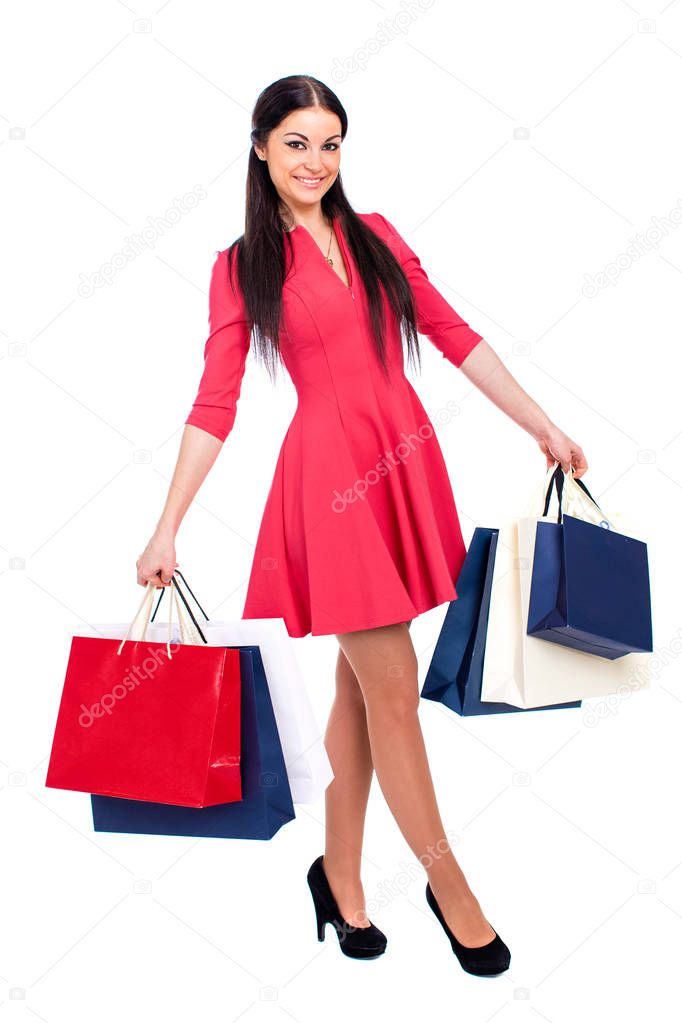Young brunette woman with some shopping bags 