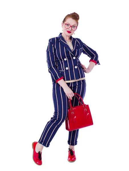 Stylish middle-aged lady in impressive checkered suit